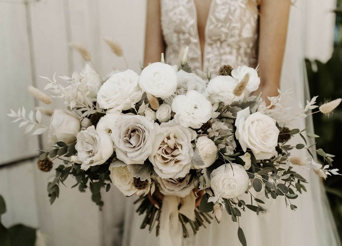 bride holding a white bouquet